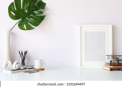 Mockup Workspace Desk And Copy Space Books,plant And Coffee On White Desk. 