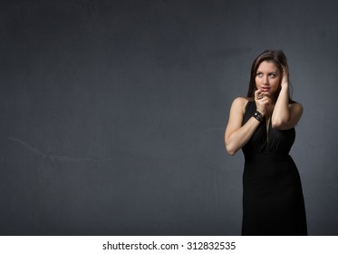 model alluring and touching lips, dark background