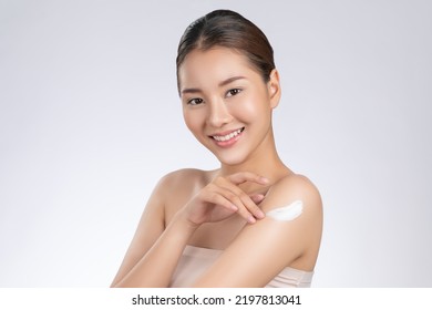 Model applying body lotion cream . Gorgeous quality cream lotion is applying by beauty model on her body showing healthy skin of the model improved by the body lotion cream . - Shutterstock ID 2197813041