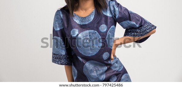 Model in a Blue African\
Print Dress