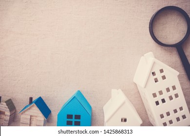 Model Blue And White Houses And Magnifying Glass, Finding Right House Property, House Searching, Home Insurance Concept