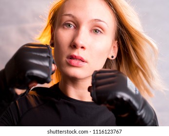 Model In Boxing Gloves With Hair Blown Away 