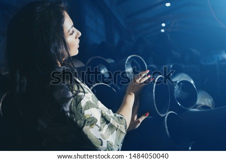 Image, Stock Photo A woman opens the yellow garbage can