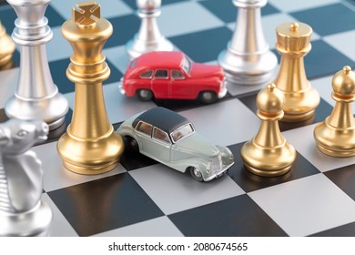 A Model Of A Car Among Chess Pieces