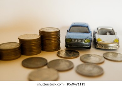 Model Cars For Car Loan Concept. Saving Money For Buying A Car. Car Insurance And Premium Paid Or Claiming For Cash. Selective Focus. 