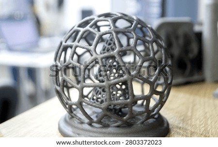 Model Christmas tree in mesh ball printed on 3D printer from polyamide powder close-up. Technology Multi Jet Fusion, MJF. Three-dimensional model created on 3D printer from powder plastic