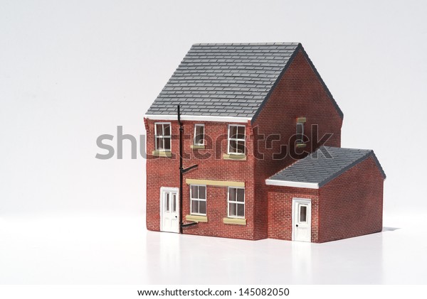 Model of detached\
house on white background