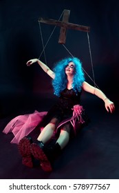 model in form of puppet doll with ropes and straps for puppet master