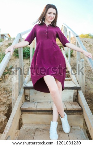 Similar – Woman in front of a yellow beach house