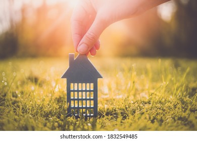 Model Of Gray Apartment House On Autumn Yellow Grass On A Sunny Day. Conceptual Symbol Of Renting, Hostel And Student Housing.