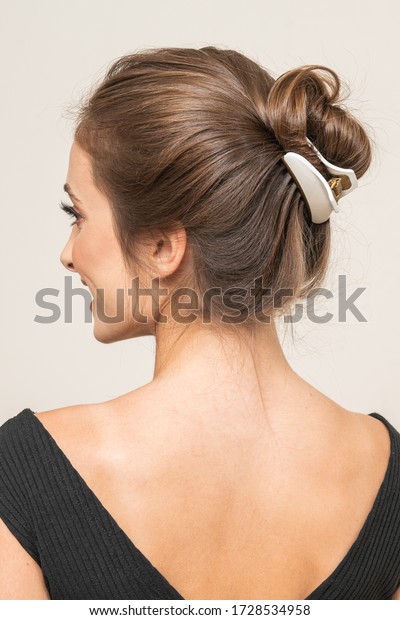 Model With Hair\
Clips, posing, close up. 