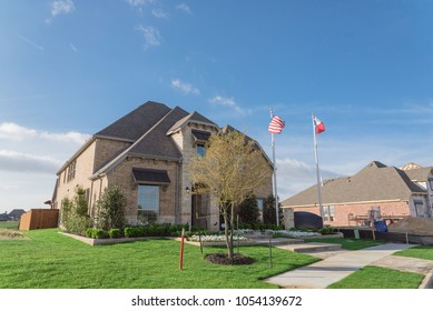 Model home and construction office of new boutique community neighborhood in Irving, Texas, USA. Brand new two story residential house, newly constructed, freshly built with landscaped yard