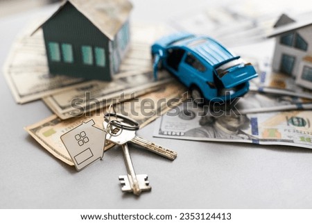 Model house and car with your deposit money. Real estate and mortgage investment concept.