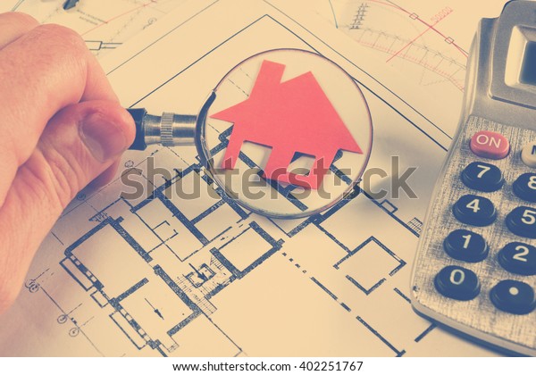 Model house, construction plan for house\
building, keys. Real Estate Concept.\
