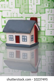 Model of a house on a background of the draft