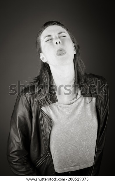model isolated on plain background face sticking\
tongue out