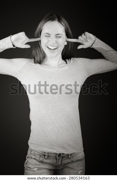 model isolated on plain background plugging ears\
with fingers
