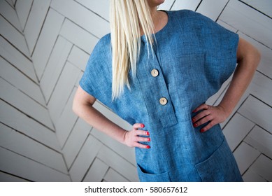 Model With Long Blond Hair Posing In Blue Linen Dress
