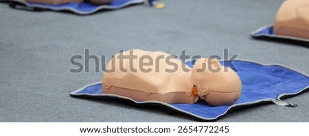 Model manikin use for practice during Emergency courses . Demonstrating Cardiopulmonary resuscitation training medical procedure on CPR doll in the class.First aid for safe life concept for people.