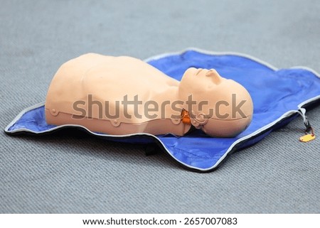 Model manikin use for practice during Emergency courses . Demonstrating Cardiopulmonary resuscitation training medical procedure on CPR doll in the class.First aid for safe life concept for people.