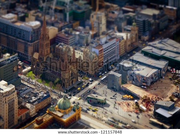 Model Melbourne. Tilt shift photography of\
the real Melbourne in Victoria, Australia. City streets and\
buildings made to look like\
miniatures.