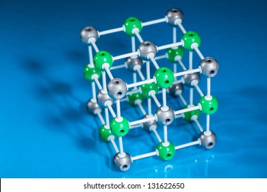 Model of molecular structure on blue reflective background