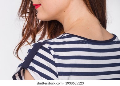 Model In A Navy Blue Skirt And A Striped Blouse On A Light Background.