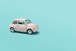 Model Pink Retro Toy Car On Green Background. Miniature Car With Copy Space