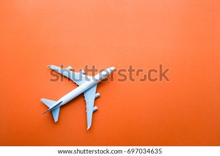 Model plane,airplane on pastel color background.Flat lay design.