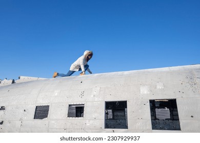 Model Posing infront of an old DC3 wreckage in Iceland