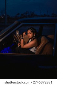 model posing from inside a car
