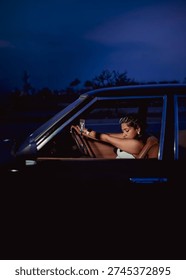 model posing from inside a car