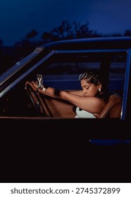 model posing from inside a car