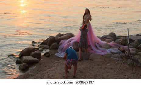 Model Posing In Zara Bright Dress At Lake Shore.Minsk.Belarus - July 05 2021