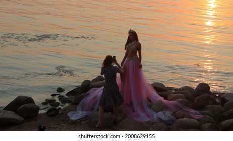 Model Posing In Zara Bright Dress At Lake Shore.Minsk.Belarus - July 05 2021