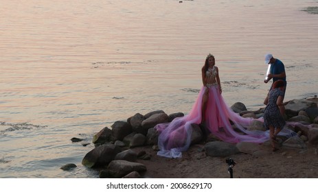 Model Posing In Zara Bright Dress At Lake Shore.Minsk.Belarus - July 05 2021