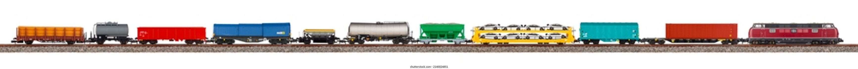 Model Railway Freight Train With Colorful Wagon Isolated On White Wide Panorama Background.  Railroad Hobby Transportation Logistic Concept