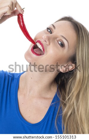Model Released. Attractive Young Woman Holding a Red Chilli Pepper