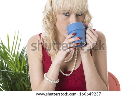 Model Released. Attractive Young Woman Drinking Coffee