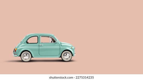 Model retro toy car on pink peach background. Miniature car with copy space