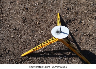 Model rocket launch pad sits in the dirt outside - Powered by Shutterstock