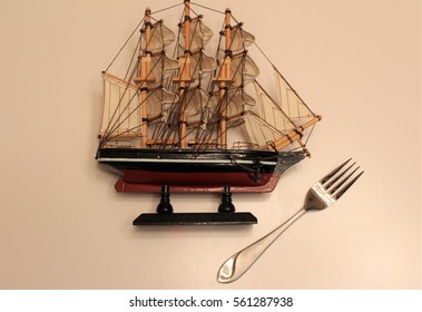 Model Ship and a Fork - Shutterstock ID 561287938