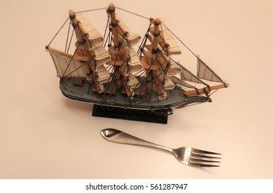 Model Ship and a Fork - Shutterstock ID 561287947