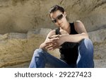 Model sitting on the rocks