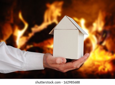 Model Of Small House In Front The Fire