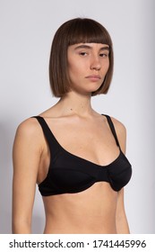 Model Snap Portrait In Black Bra On White Background, 3/4 Polaroid Shot For Modelling Portfolio