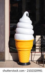 A Model Of Soft Serve Ice Cream Placed In Front Of An Ice Cream Shop. Promotional Concept.