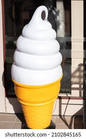 A Model Of Soft Serve Ice Cream Placed In Front Of An Ice Cream Shop. Promotional Concept.