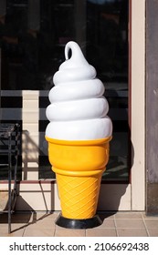 A Model Of Soft Serve Ice Cream Placed In Front Of An Ice Cream Shop. Promotional Concept.