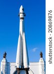 Model of space rocket behind blue sky